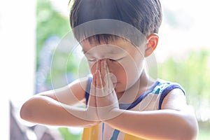 A little prayer, A boy is praying seriously and hopefully to Jesus