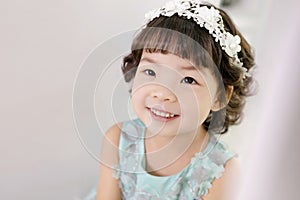 Little pretty Asian girl dressing as princess laughing portrait, healthy and happy lifestyle