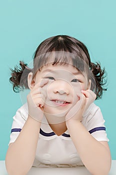 Little pretty Asian girl laughing portrait with milk and bread, healthy and happy lifestyle