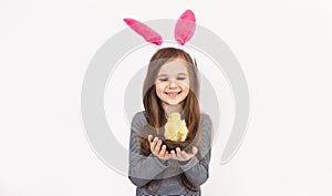 Little pretty kid girl hold fluffy chickens isolated on white background children studio portrait. Childhood lifestyle. Happy