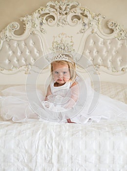 Little princess. Little girl wear tiara crown and hairstyle. Hair accessory. Little child with long blond hair. Small