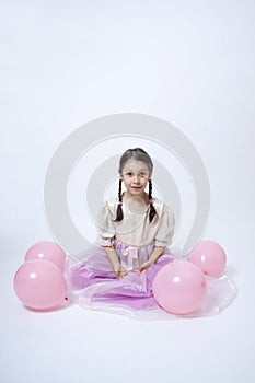 Little princess with pink balloons