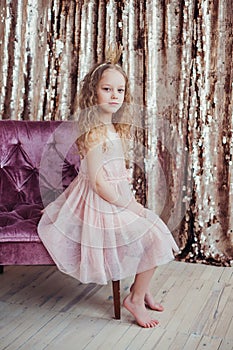 Little princess. Pretty girl with golden crown. photo