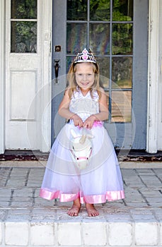 Little princess riding a unicorn