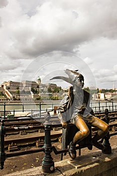 The Little Princess statue on the Danube Promenade in Budapest, Hungary.