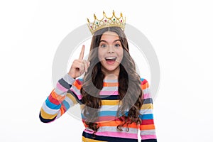 Little queen wearing golden crown. Teenage girl princess holding crown tiara. Prom party, childhood concept. Excited