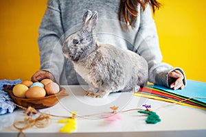 Little rabbit with a basket with decorated egg - Easter card