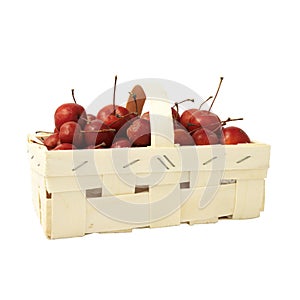 Little red apples in a basket