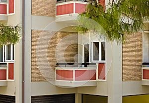 Little red balcony of a vintage building with brick walls Pesaro, Italy