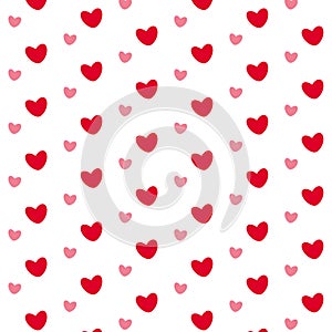 Little red and pink hearts on white backdrop. Valentine's Day. Romantic pattern. Cute seamless background