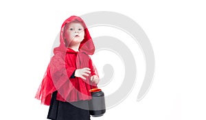 Little Red Riding Hood. Beautiful little girl in a red raincoat. Halloween