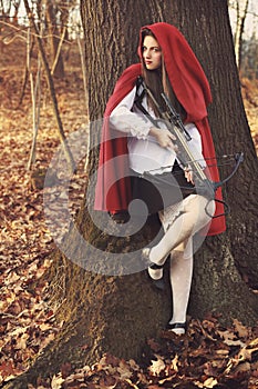 Little red riding hood waits her prey