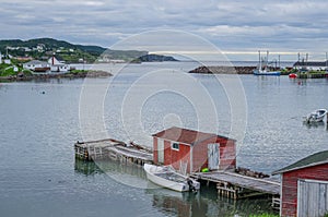 Little red shed & boat on a dock in Twillingate. photo