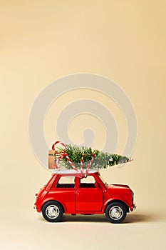 Little red toy car and Christmas tree