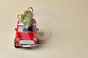 Little red toy car and Christmas tree