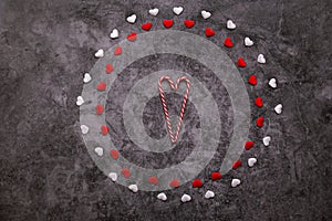 Little red and white hearts on a black stone background. Valentine`s day frames with copyspace