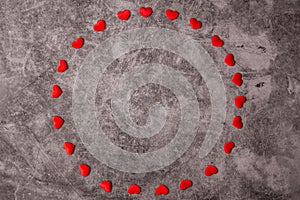 Little red and white hearts on a black stone background. Valentine`s day frames with copyspace