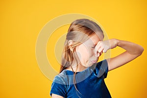 Little Redhead Girl Covering Nose For Bad Smell