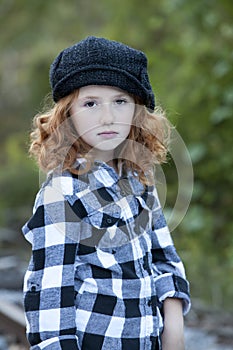 Little redheaded girl outdoors