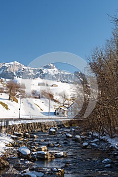 Little river in front of the mount Hoher Kasten in winter time in Switzerland