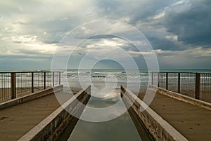 A little river pours its waters into the Adriatic sea