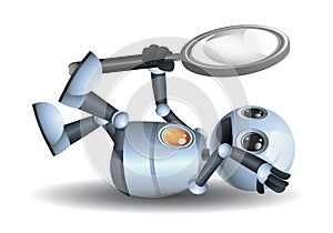 little robot holding magnifier laying down seeing up