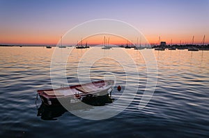 Little rowing boat in the port of Umag