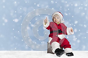 Little santa claus outdoors in the snow