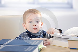 Little scholar with encyclopedia