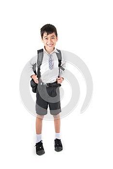 Little school boy wearing student uniform for first day school
