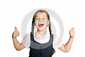 Little school girl showing thumbs up