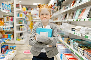 Little school girl in stationery store