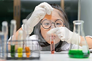 Little scientist use dropper to making experiment photo