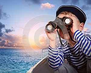 Little ship boy with binocular photo