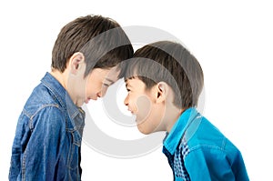 Little sibling boy fighting on white background