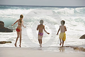 Little Siblings Running In Water