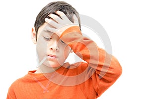 Little sick boy with temperature check thermometer in mouth on white background