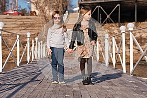 Little sisters on the pier