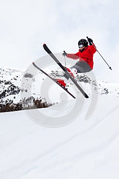 Little skier jumping in the snow.