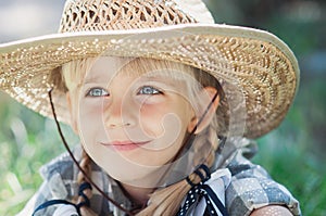 little smile cowboy girl on the ranch