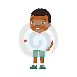Little smiling boy holding empty banner flat vector illustration. Cute school kid with blank paper sheet in hands isolated on whit