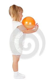 Little smiling girl with ball