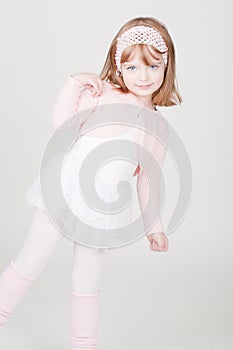 Little smiling girl in ballerina costume