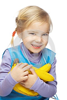 Little smiling girl with bananas