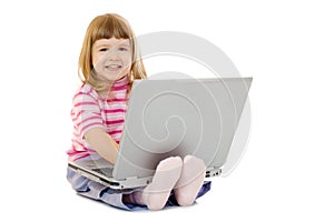 Little smiling girl with laptop