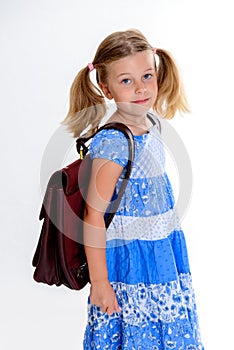 Little smiling girl with old satchel