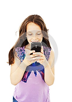 Little smiling girl reading sms on your cell phone