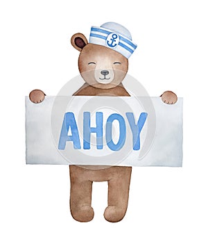 Little smiling teddy bear holding paper sign with word `Ahoy`.