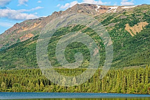 A little snow on the mountaintops at Kiniskan Lake Provincial Park in British Columbia, Canada