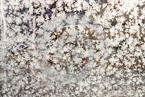 Little snowflakes on glass. Close up.Winter background.